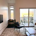 Flexhome Skywalk To Fiserv U9 With Rooftop, Gym, And Parking
